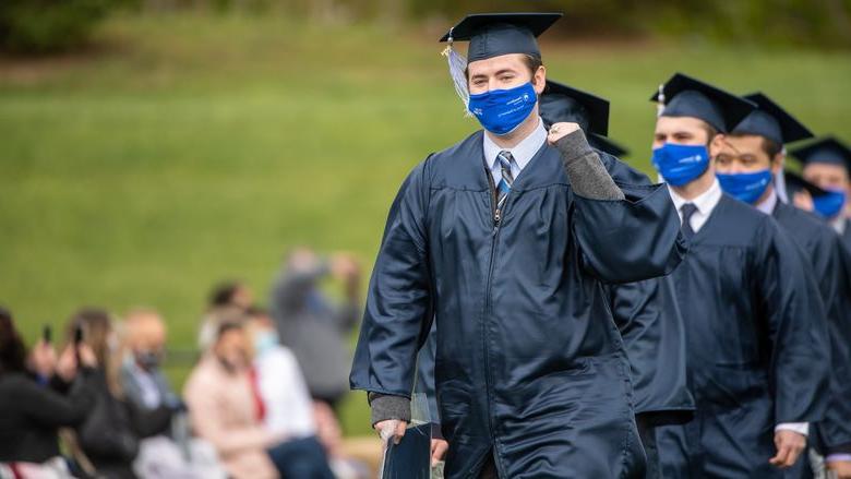 Penn State Behrend graduates celebrate as they leave the stadium at the conclusion of an outdoor ceremony on 5月8日.